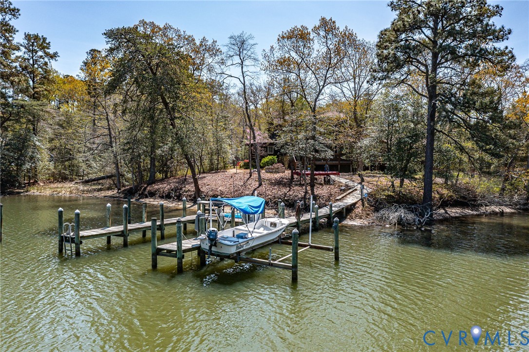 176 Baypointe Court Reedville, VA 22539 - Photo 3 of 60 a view of swimming pool with outdoor seating and lake view
