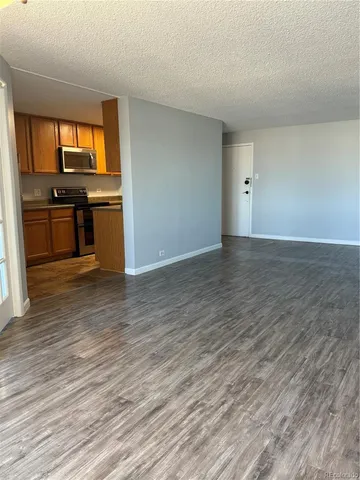 a view of kitchen with granite countertop window and a sink