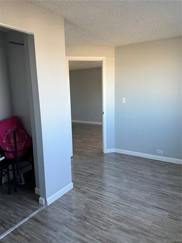 a view of hallway with wooden floor