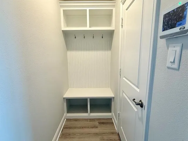 a bathroom with a toilet and a window