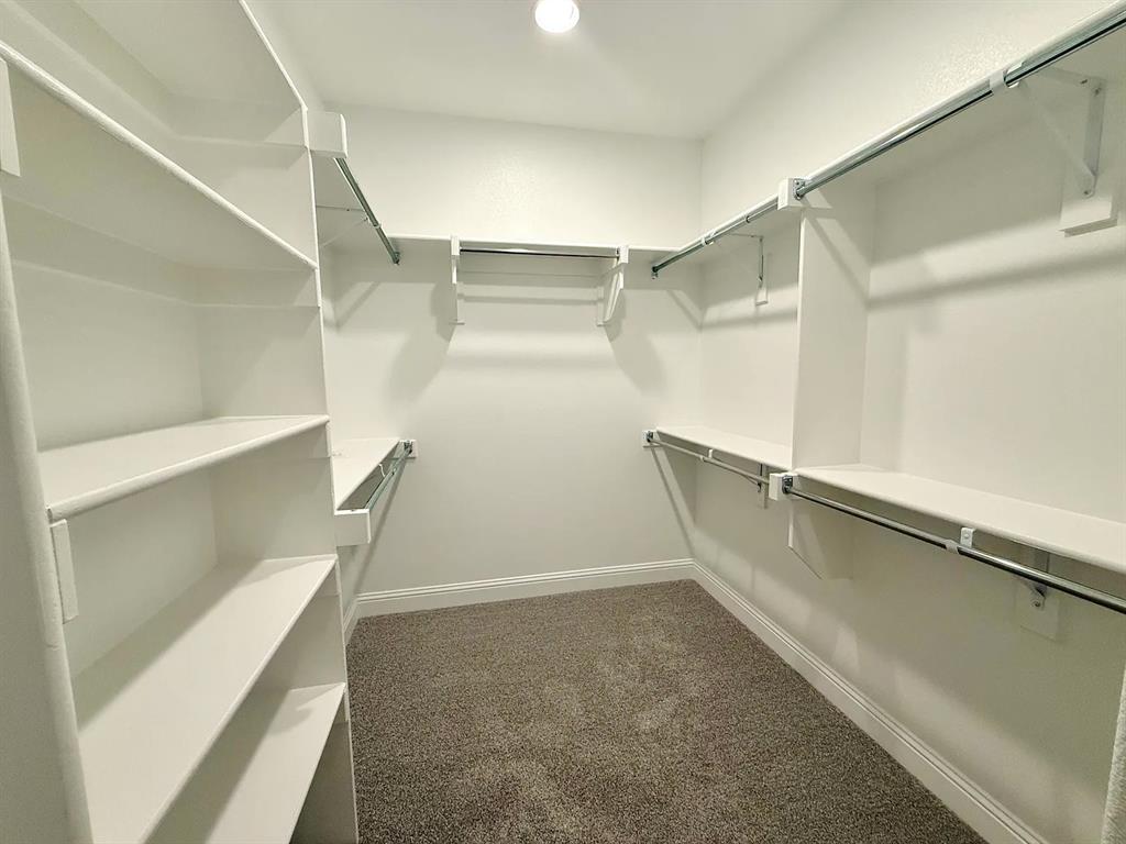 2708 Shiners Street Forney, TX 75126 - Photo 15 of 25 a view of an empty walk in closet