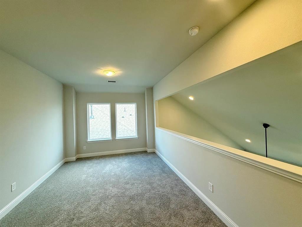 2708 Shiners Street Forney, TX 75126 - Photo 18 of 25 a view of a room window and a ceiling fan