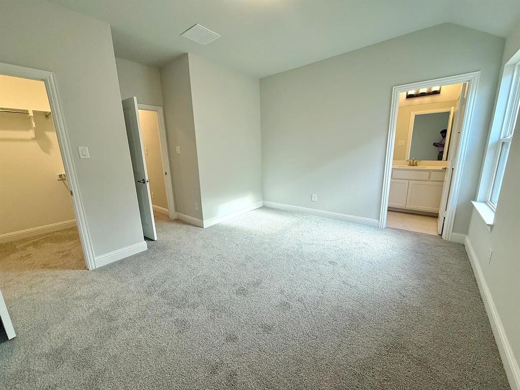 2708 Shiners Street Forney, TX 75126 - Photo 21 of 25 an empty room with closet and windows