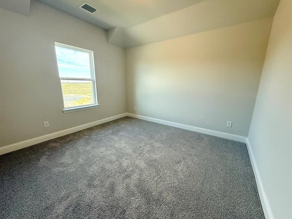 2708 Shiners Street Forney, TX 75126 - Photo 25 of 25 an empty room with a window