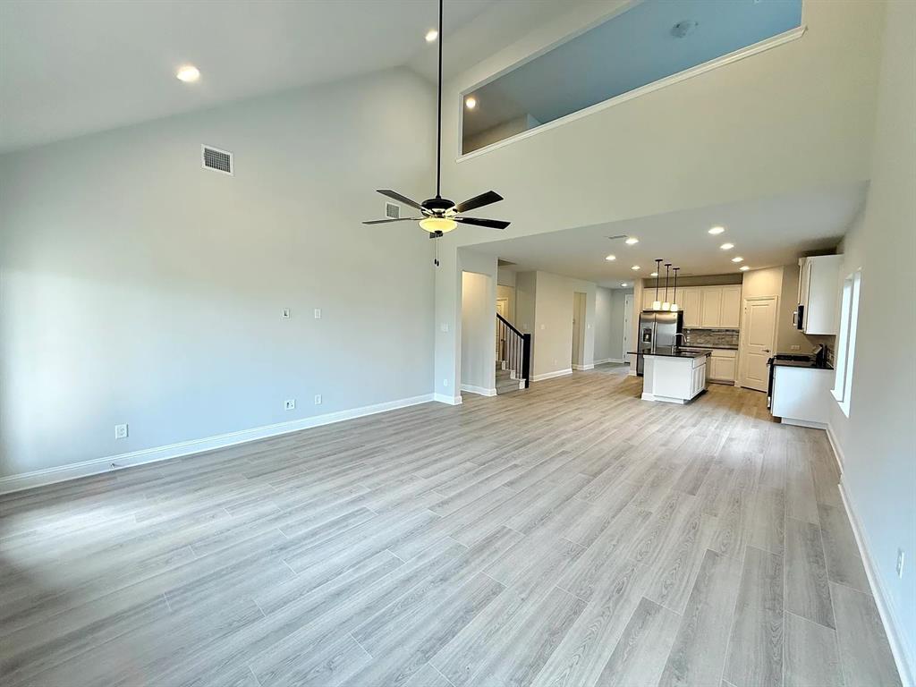 2708 Shiners Street Forney, TX 75126 - Photo 4 of 25 a view of a kitchen with a sink and a stove top oven