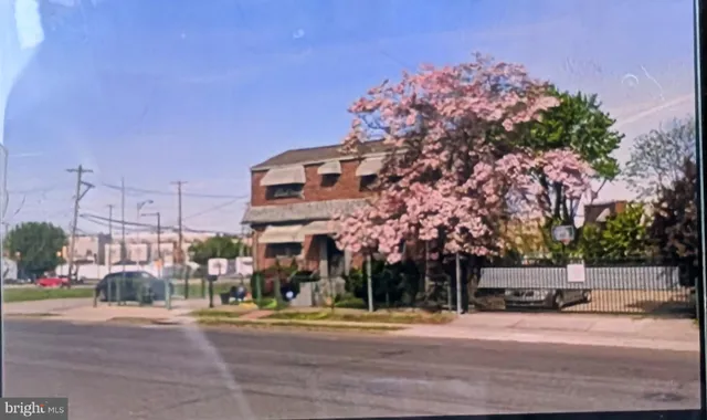 a front view of a building with street view