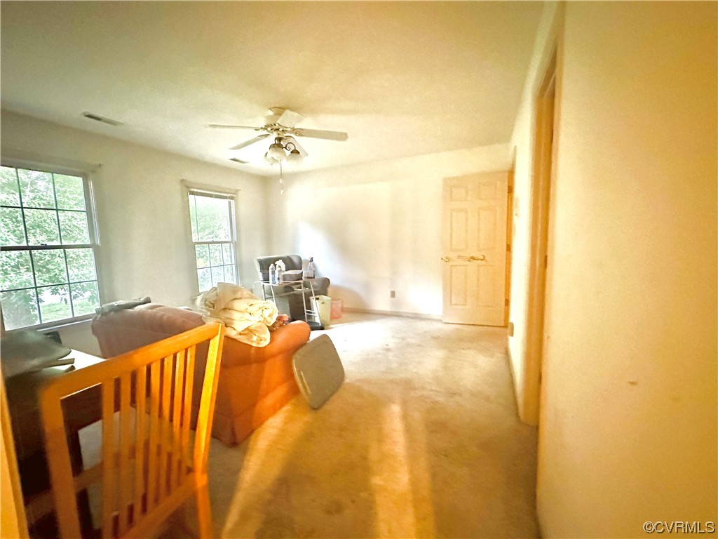 13002 Rockridge Road Chester, VA 23831 - Photo 14 of 49 a bed sitting in a bedroom next to a window