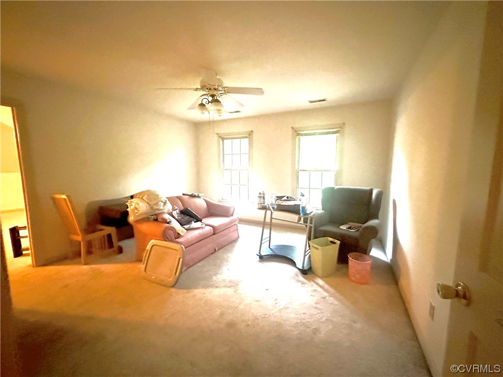 13002 Rockridge Road Chester, VA 23831 - Photo 15 of 49 a living room with furniture and a flat screen tv