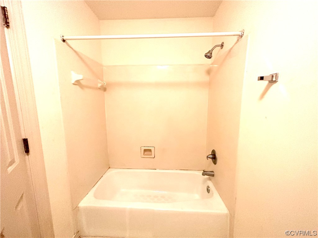 13002 Rockridge Road Chester, VA 23831 - Photo 20 of 49 a bathroom with a white bath tub