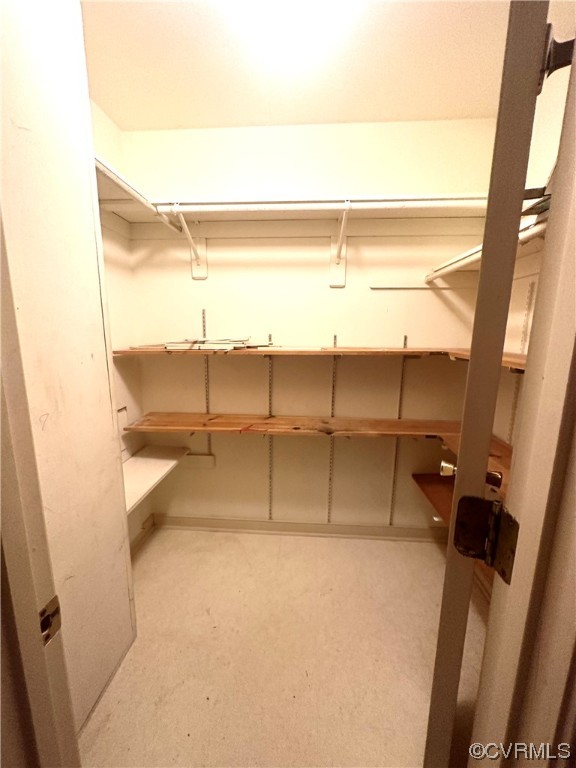 13002 Rockridge Road Chester, VA 23831 - Photo 22 of 49 a view of walk in closet with empty racks