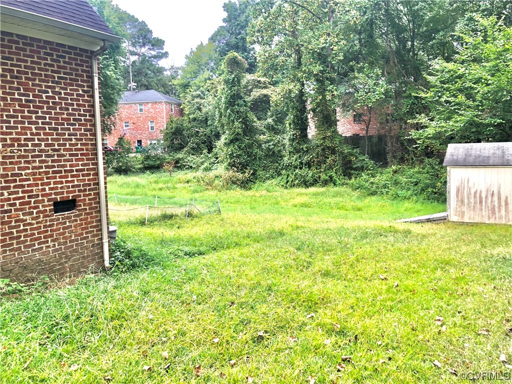 13002 Rockridge Road Chester, VA 23831 - Photo 3 of 49 a view of a yard with plants and wooden fence