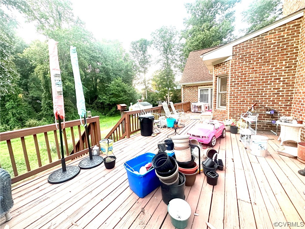 13002 Rockridge Road Chester, VA 23831 - Photo 35 of 49 a view of balcony with furniture and garden