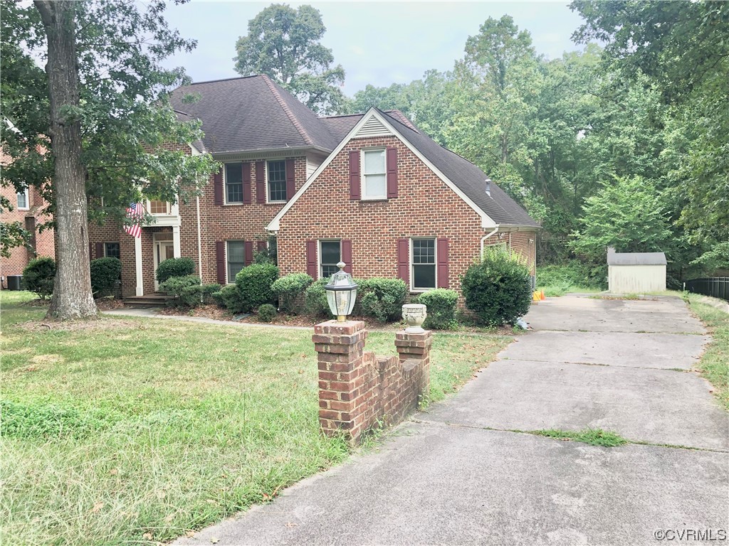13002 Rockridge Road Chester, VA 23831 - Photo 5 of 49 a front view of a house with garden