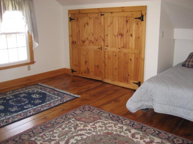 2 Tolland Road Sandisfield, MA 01255 - Photo 6 of 8 a bedroom with a bed and a window