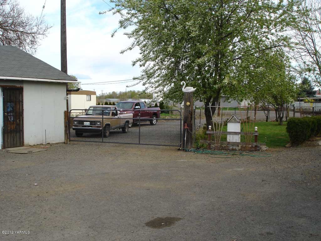 171 East McDonald Road Toppenish, WA 98948 - Photo 2 of 7 a view of street with parked cars