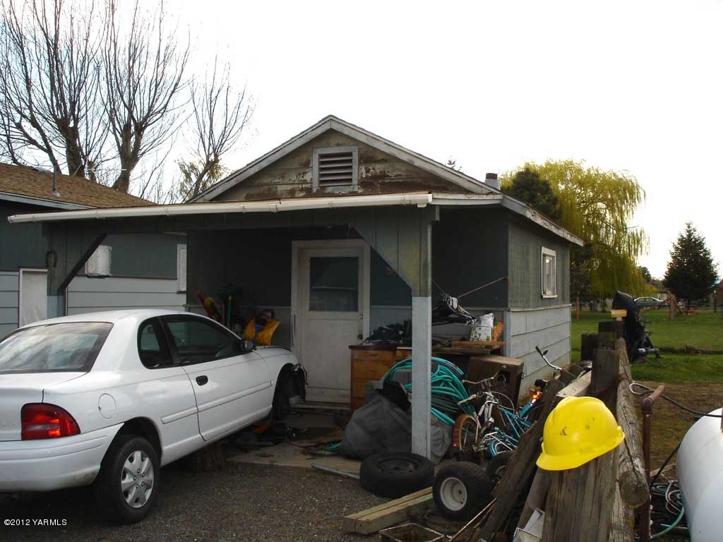 171 East McDonald Road Toppenish, WA 98948 - Photo 7 of 7 a view of a car parked in front of a house