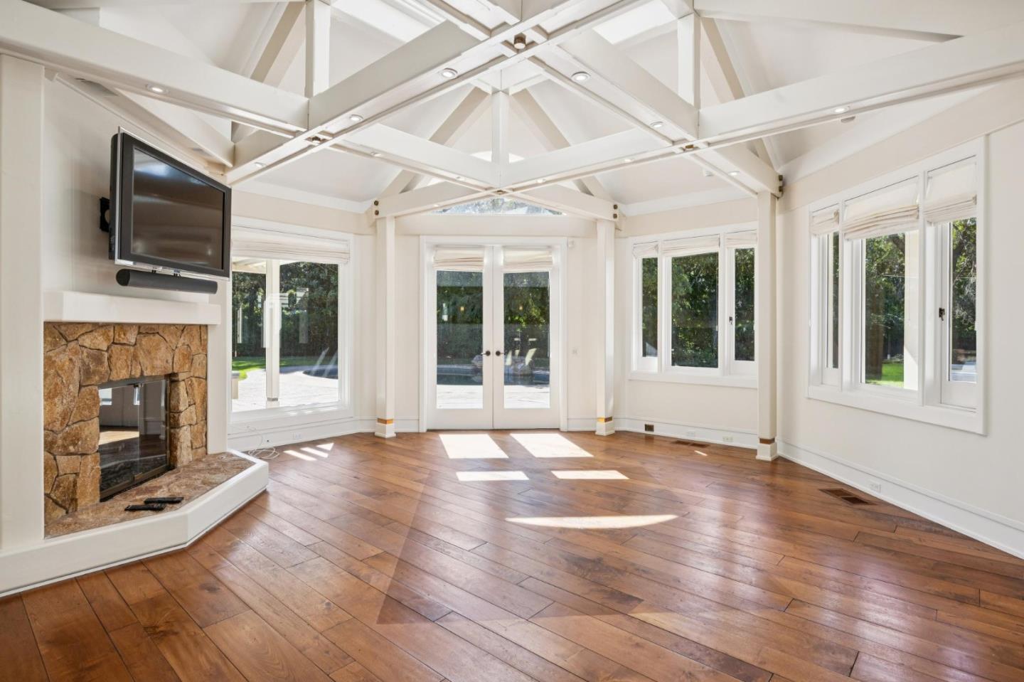 39 Faxon Road Atherton, CA 94027 - Photo 9 of 15 a view of an entryway with wooden floor a fire place