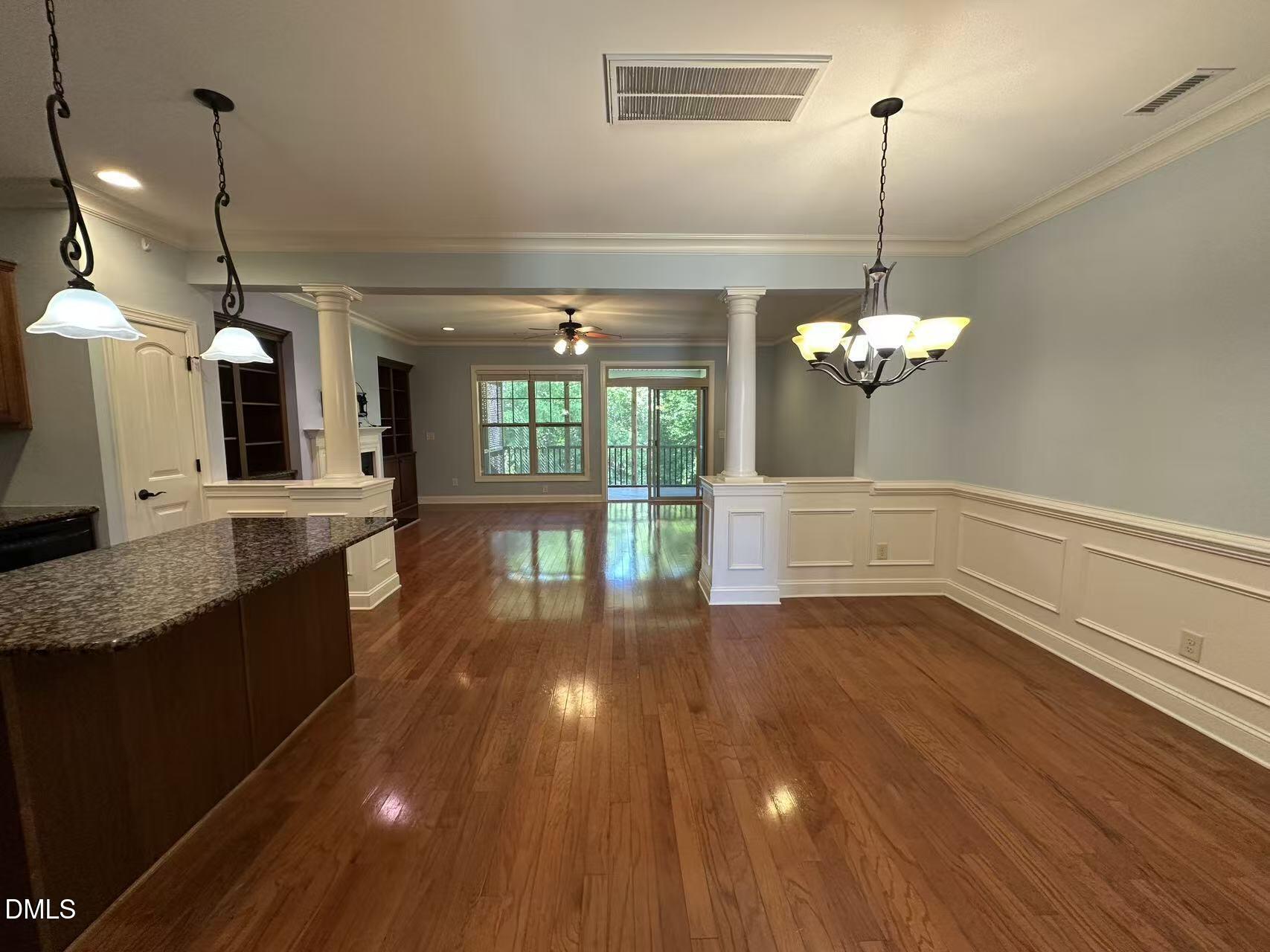 1056 Indigo Ridge Place Cary, NC 27519 - Photo 4 of 33 a view of a kitchen with a sink and wooden floor