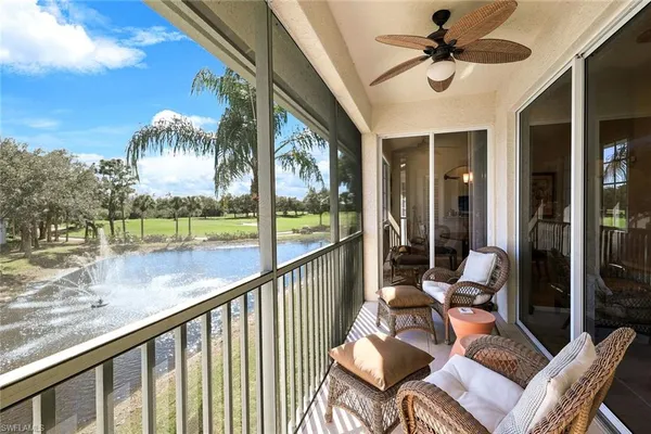 a view of a porch with furniture and a floor to ceiling window