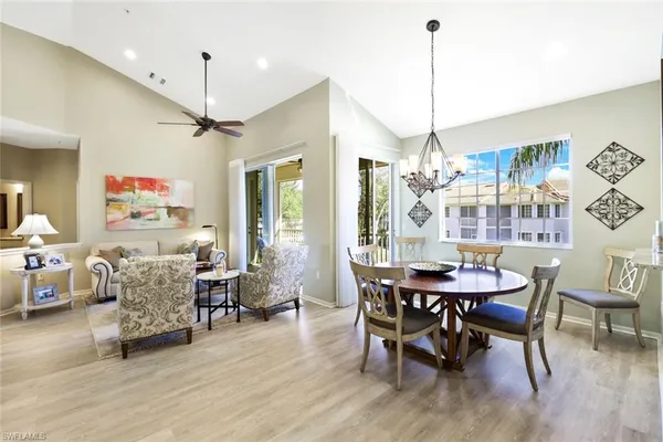 a view of a dining room with furniture window and wooden floor
