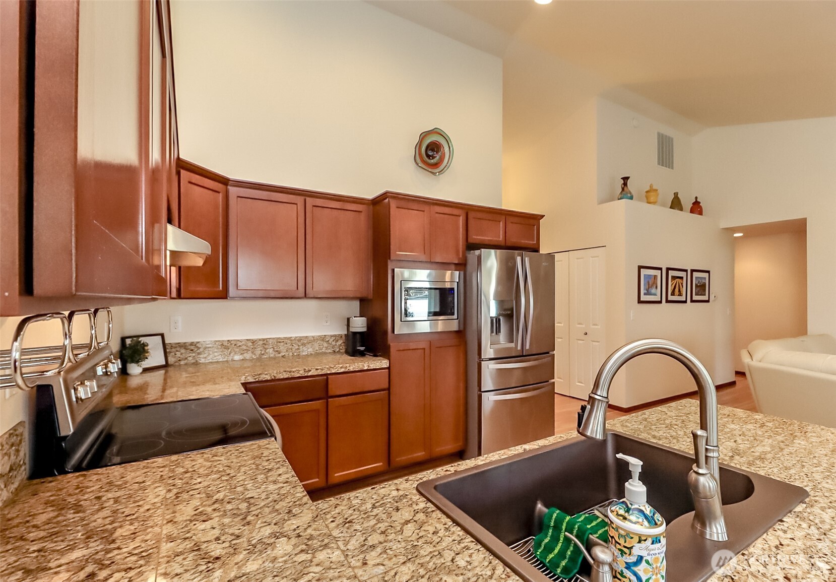 315 Dennis Way Monroe, WA 98272 - Photo 14 of 37 a kitchen with stainless steel appliances granite countertop a sink refrigerator and cabinets