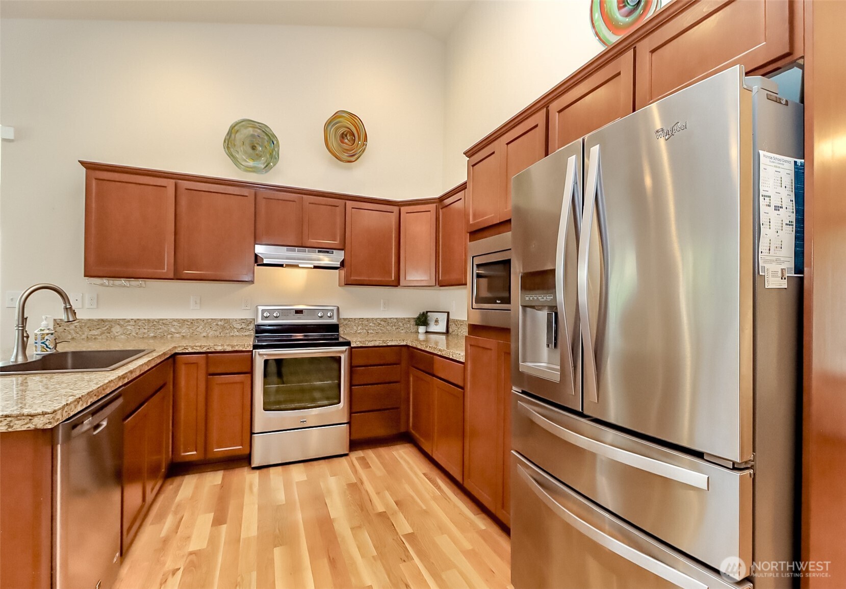 315 Dennis Way Monroe, WA 98272 - Photo 15 of 37 a kitchen with granite countertop stainless steel appliances a stove top oven a sink and dishwasher