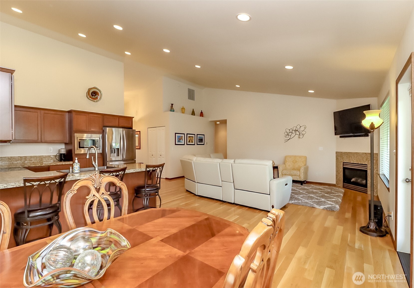 315 Dennis Way Monroe, WA 98272 - Photo 17 of 37 a living room with furniture a fireplace and a flat screen tv