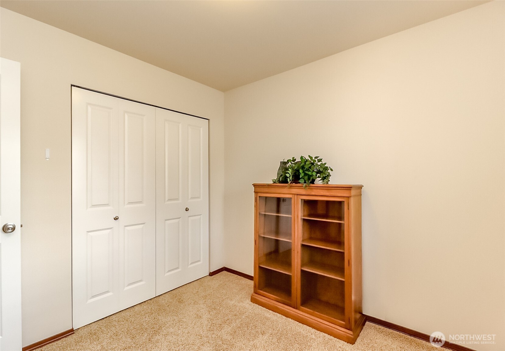 315 Dennis Way Monroe, WA 98272 - Photo 21 of 37 a view of an empty room with a cabinet and wooden floor