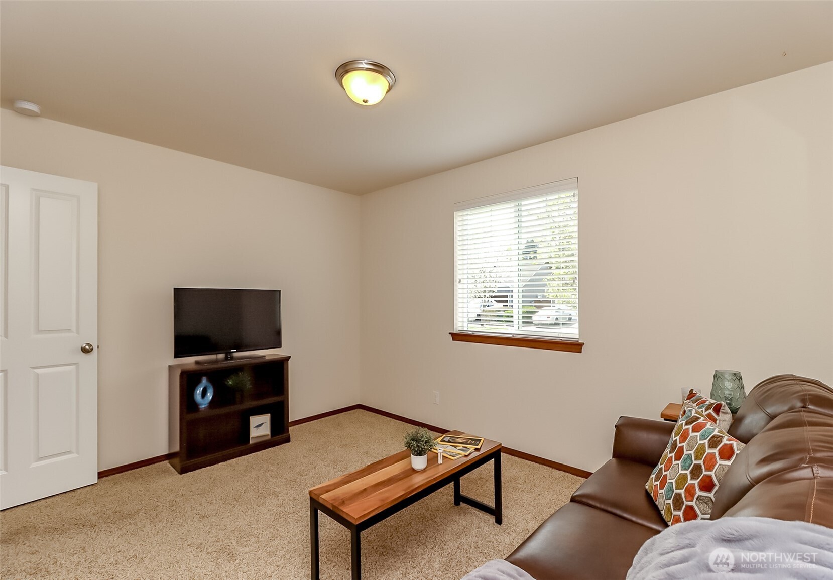 315 Dennis Way Monroe, WA 98272 - Photo 24 of 37 a living room with furniture and a flat screen tv