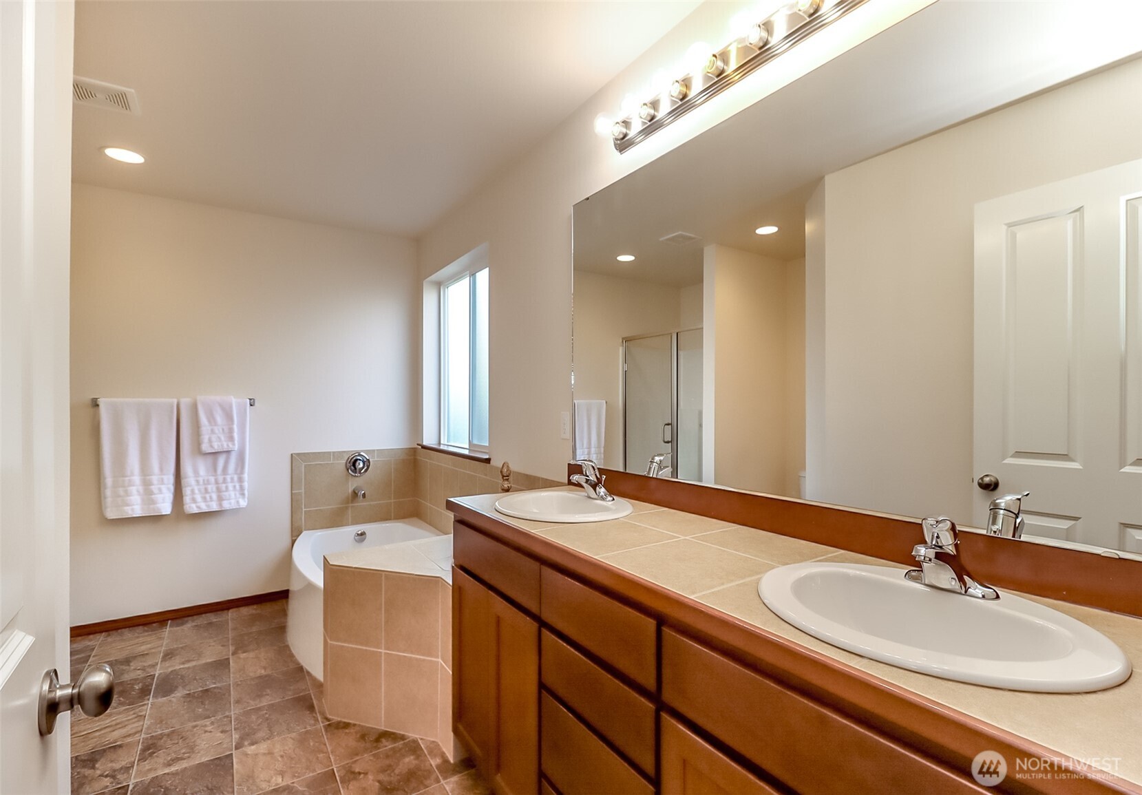 315 Dennis Way Monroe, WA 98272 - Photo 28 of 37 a en suite bathroom with a double vanity sink and a mirror