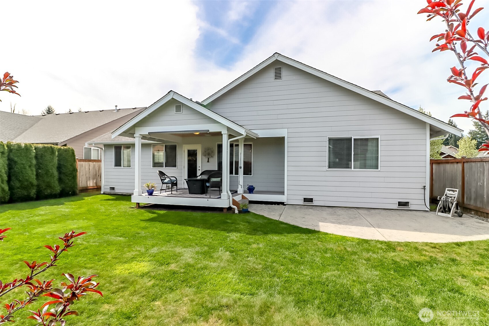 315 Dennis Way Monroe, WA 98272 - Photo 35 of 37 a front view of a house with a garden and yard