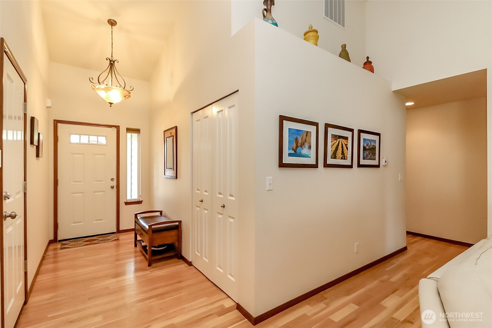 315 Dennis Way Monroe, WA 98272 - Photo 8 of 37 a view of a hallway with wooden floor and a cabinet