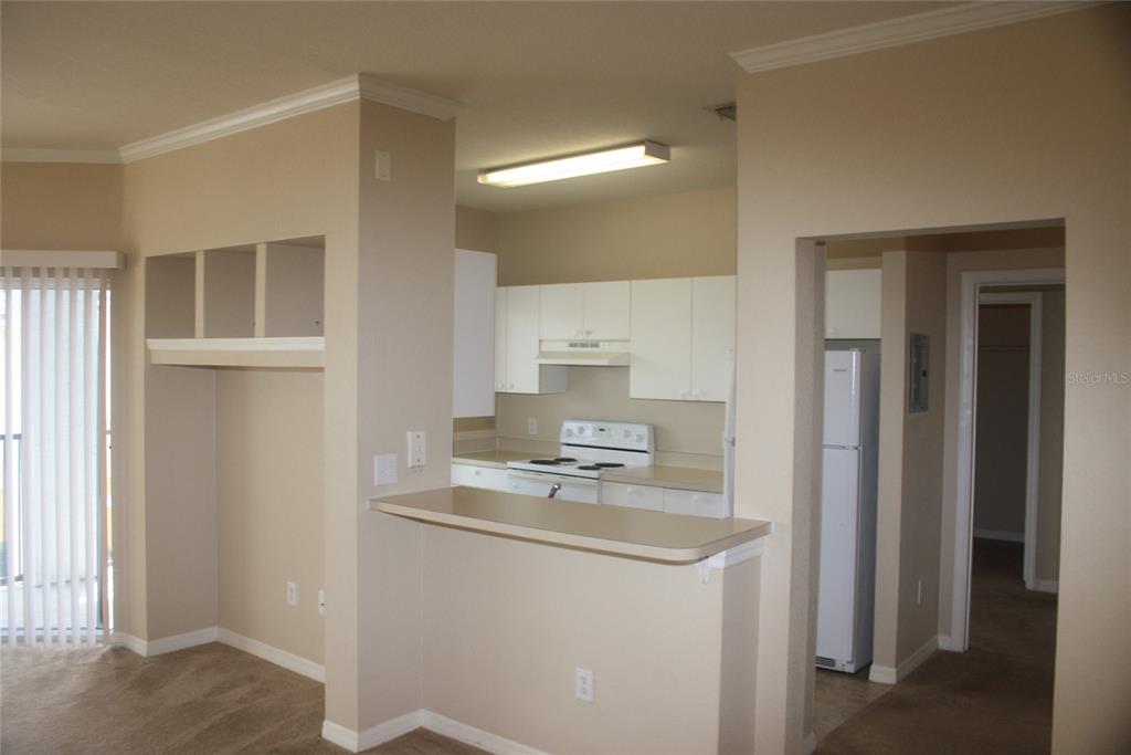 3621 Conroy Road, Unit 739 Orlando, FL 32839 - Photo 7 of 20 a bathroom with cabinets a sink and a mirror