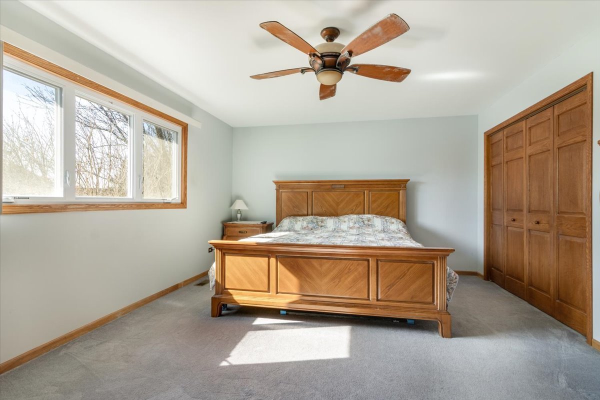 16641 West Oneida Drive Lockport, IL 60441 - Photo 12 of 24 a bedroom with a bed and a window