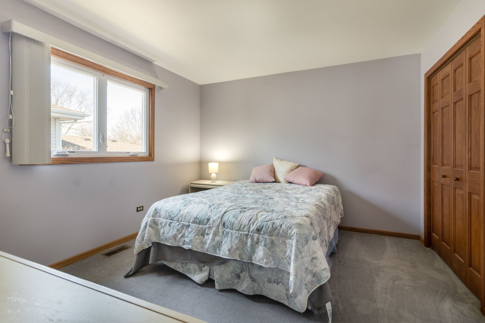 16641 West Oneida Drive Lockport, IL 60441 - Photo 15 of 24 a bedroom with a bed and window