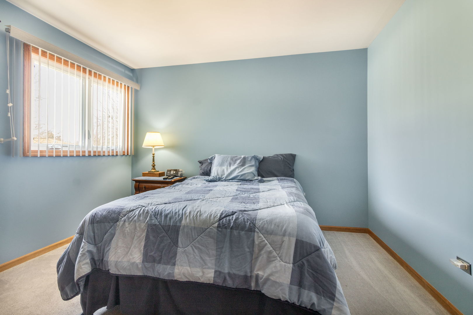 16641 West Oneida Drive Lockport, IL 60441 - Photo 16 of 24 a bedroom with a bed and window