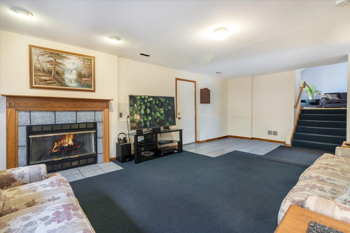 16641 West Oneida Drive Lockport, IL 60441 - Photo 19 of 24 a living room with furniture and a fireplace