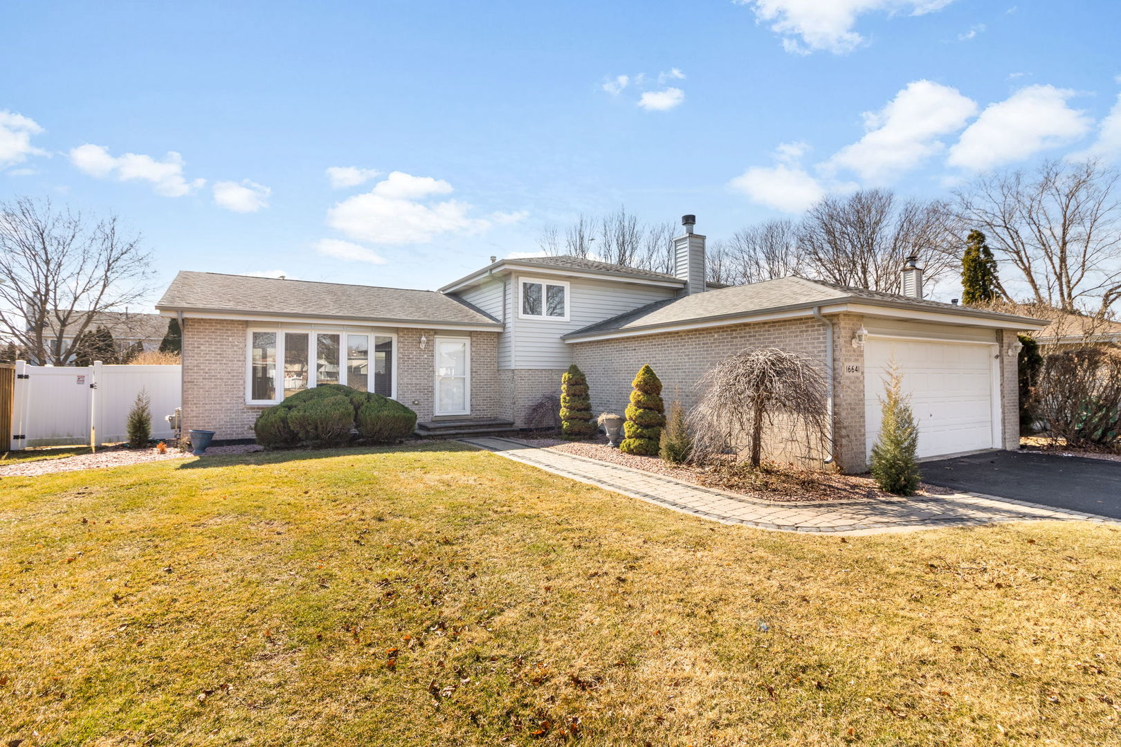 16641 West Oneida Drive Lockport, IL 60441 - Photo 2 of 24 a view of a house with snow on the ground