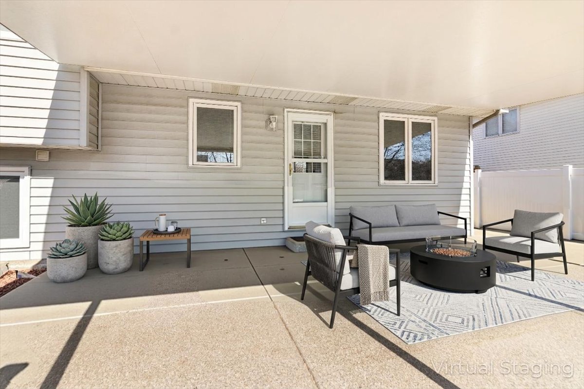 16641 West Oneida Drive Lockport, IL 60441 - Photo 22 of 24 a view of a patio with couches and potted plants