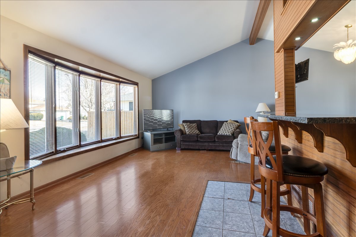 16641 West Oneida Drive Lockport, IL 60441 - Photo 3 of 24 a living room with furniture and a floor to ceiling window