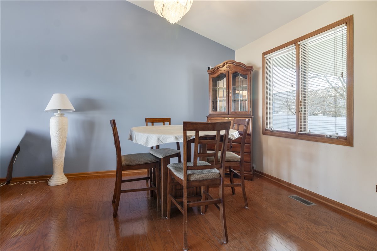 16641 West Oneida Drive Lockport, IL 60441 - Photo 6 of 24 a view of a dining room with furniture window and wooden floor