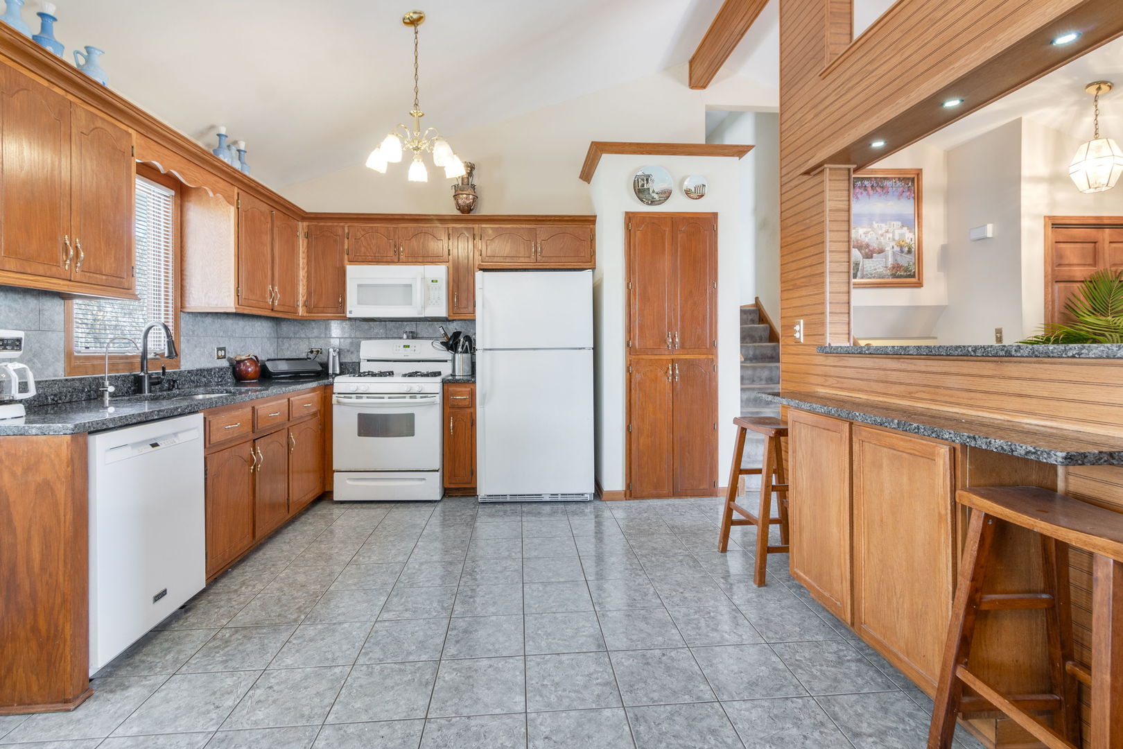 16641 West Oneida Drive Lockport, IL 60441 - Photo 8 of 24 a kitchen with stainless steel appliances granite countertop a stove a sink a refrigerator and a refrigerator