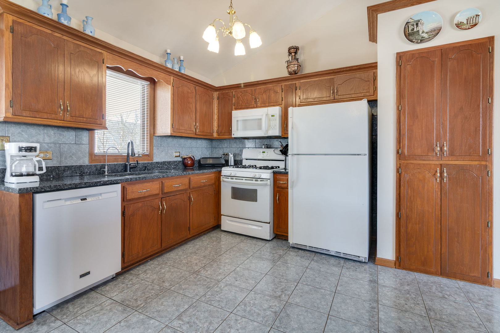16641 West Oneida Drive Lockport, IL 60441 - Photo 9 of 24 a kitchen with a sink a refrigerator and cabinets