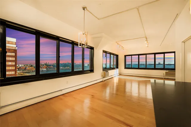 a view of empty room with a large window