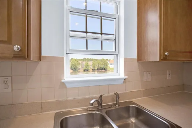 a bathroom with a sink and a window