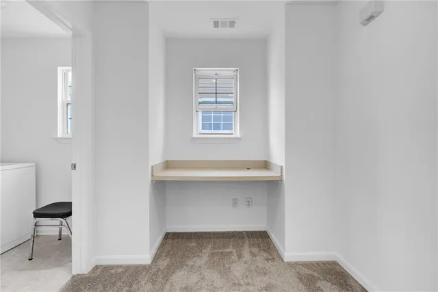 a view of livingroom and bathroom with a sink