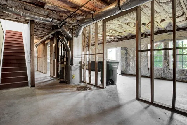 a view of a hallway with wooden stairs