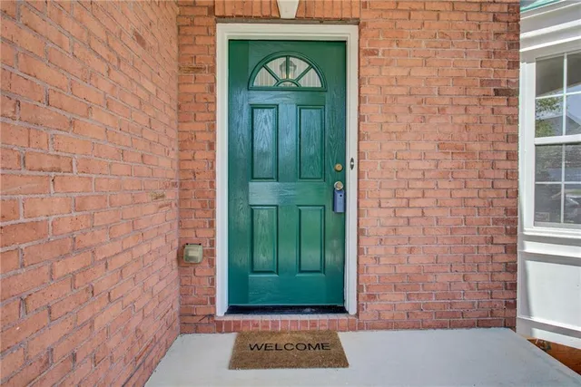 a view of a entryway door front of a house