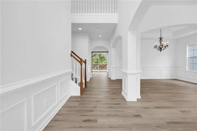 a view of an entryway with wooden floor