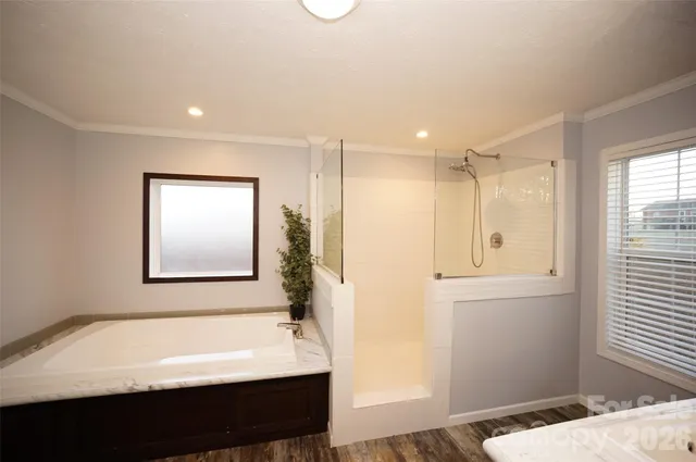 a bathroom with a bathtub and a sink